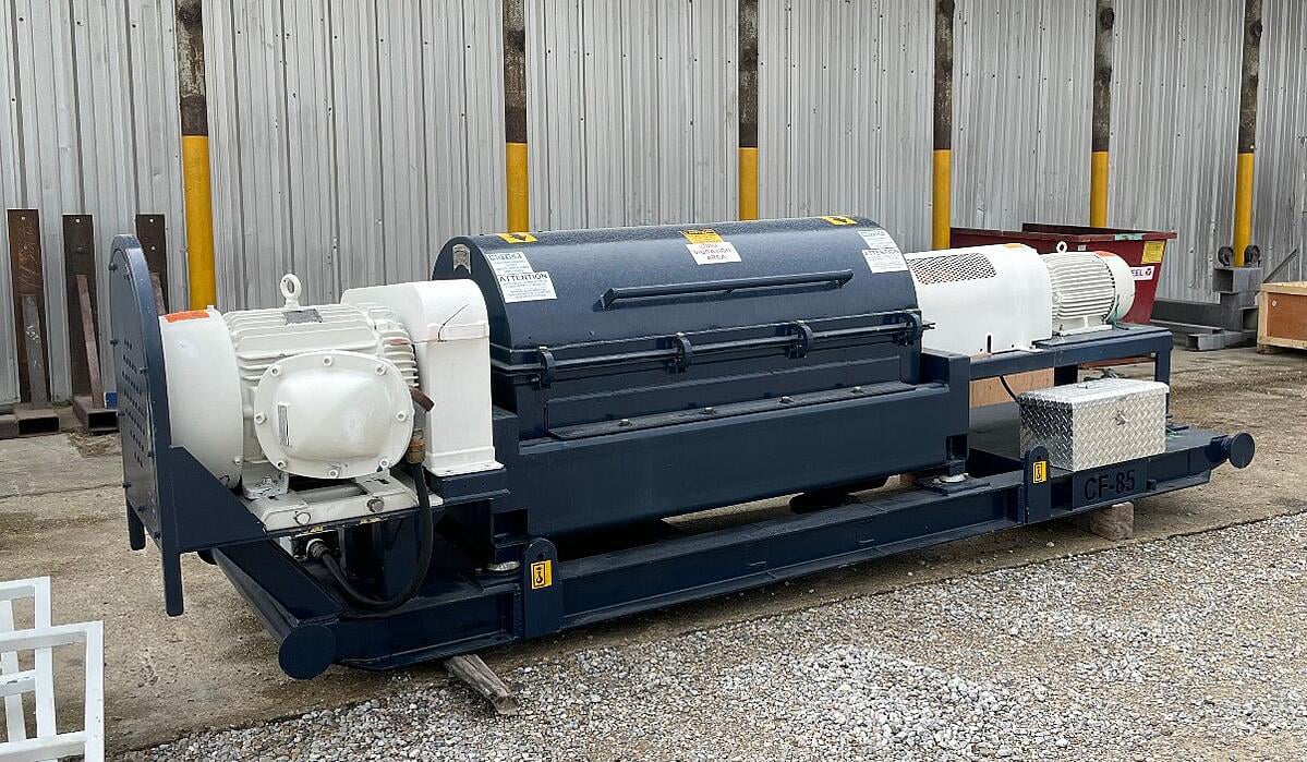 Centrifuge dewatering system processing Permian Basin oilfield sludge with CPAM